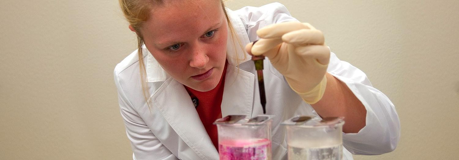 Lady working with test tubes