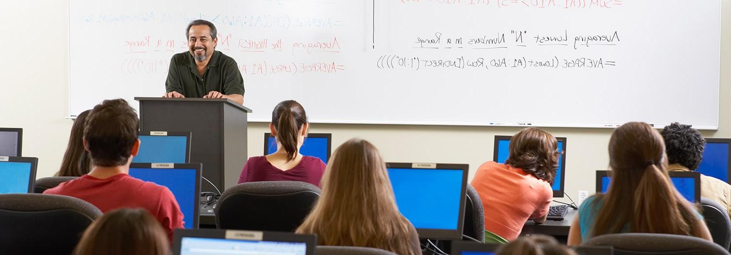 Professor in front of a classroom with students