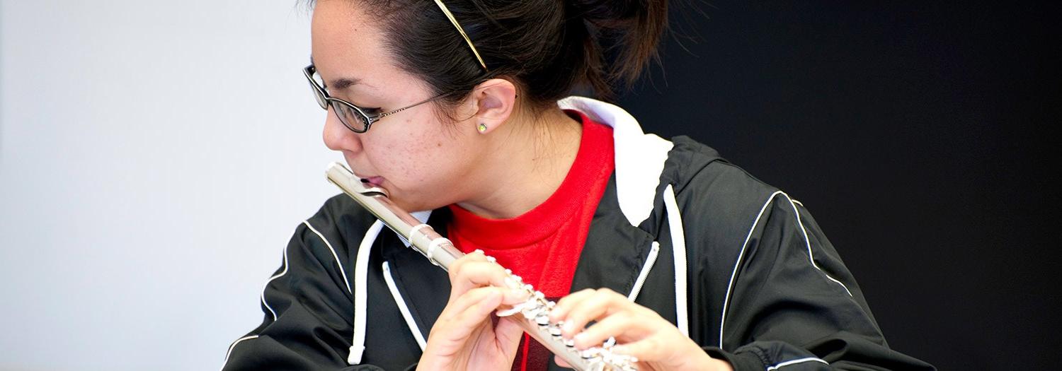 student playing flute